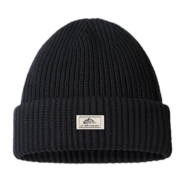 bonnet-cagoule-2-en-1-noir-laine Un bonnet cagoule 2 en 1 est présenté sur un fond blanc